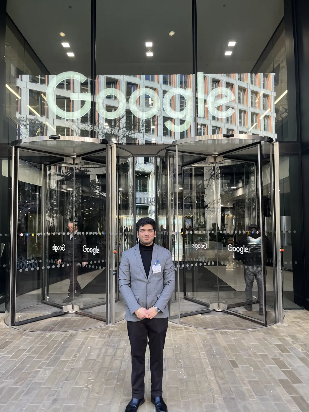 Hrishikesh outside the entrance to Google's London office.